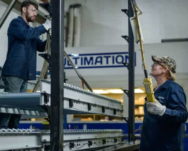Ultimation Staff Setting Up Conveyors